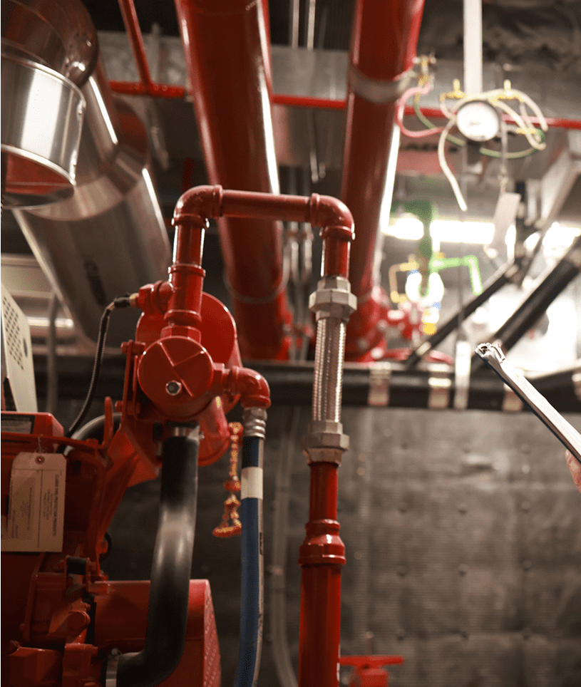 Industrial pipework with red valves and gauges